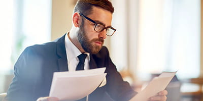 Business man reviewing paper work